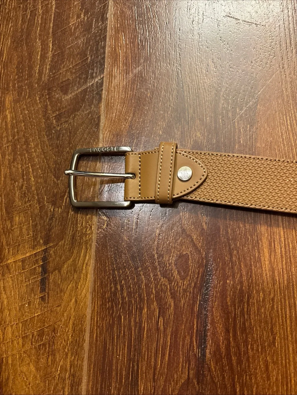 Tan Lacoste belt with textured weave pattern size 36